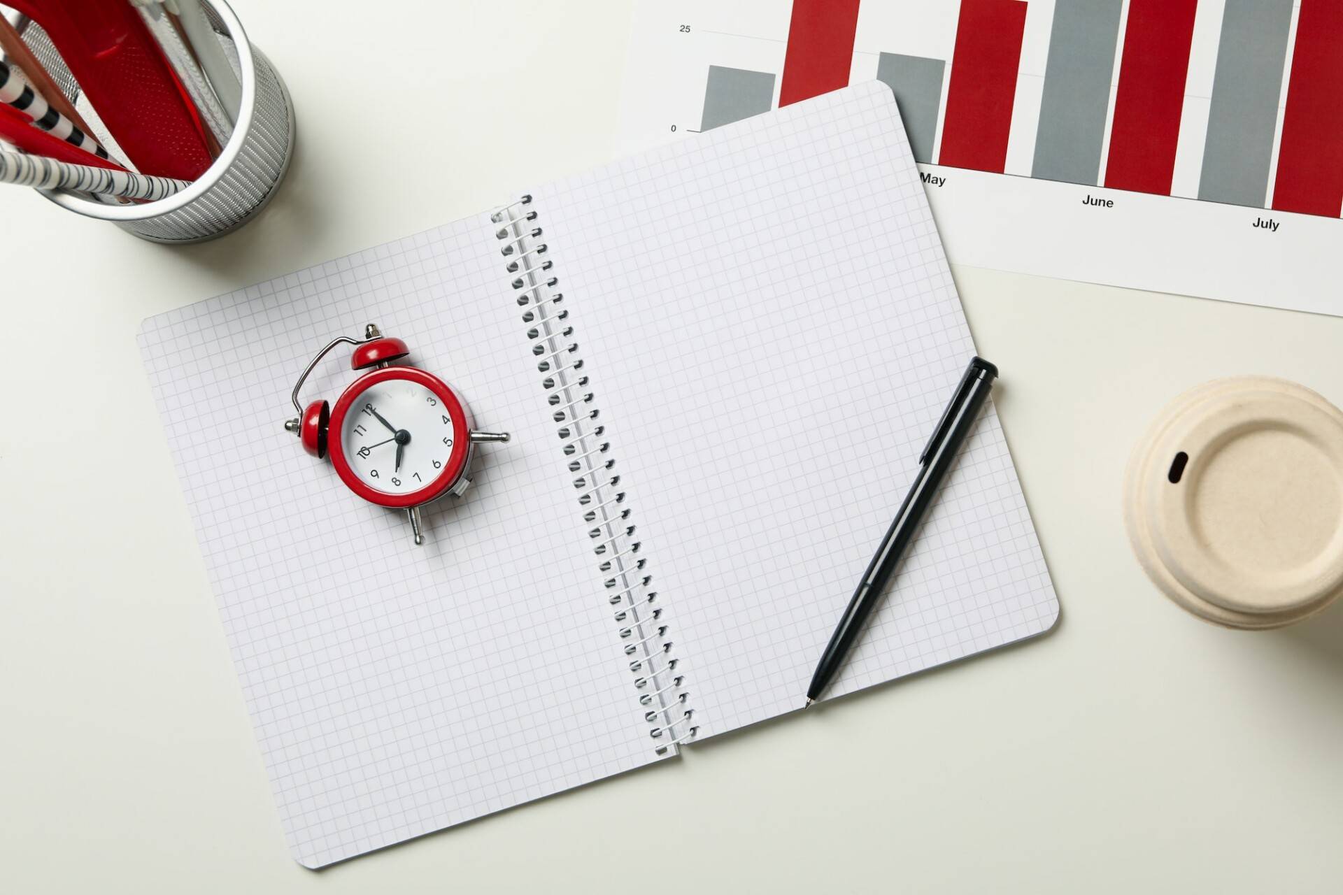 Concept of finance planning with alarm clock on white table