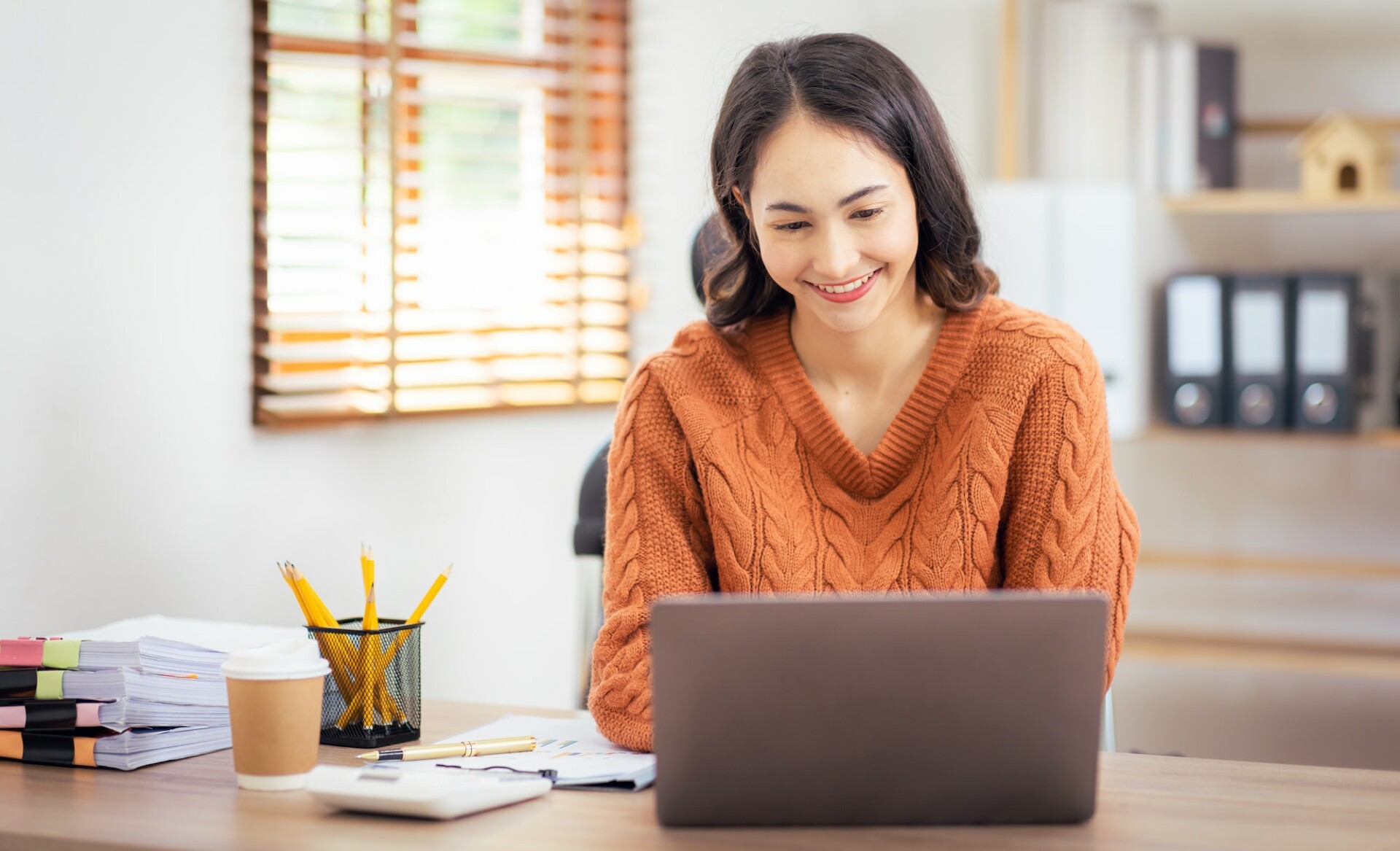 Freelancer Asian businesswoman Accounting work at home using calculating income-expenditure and