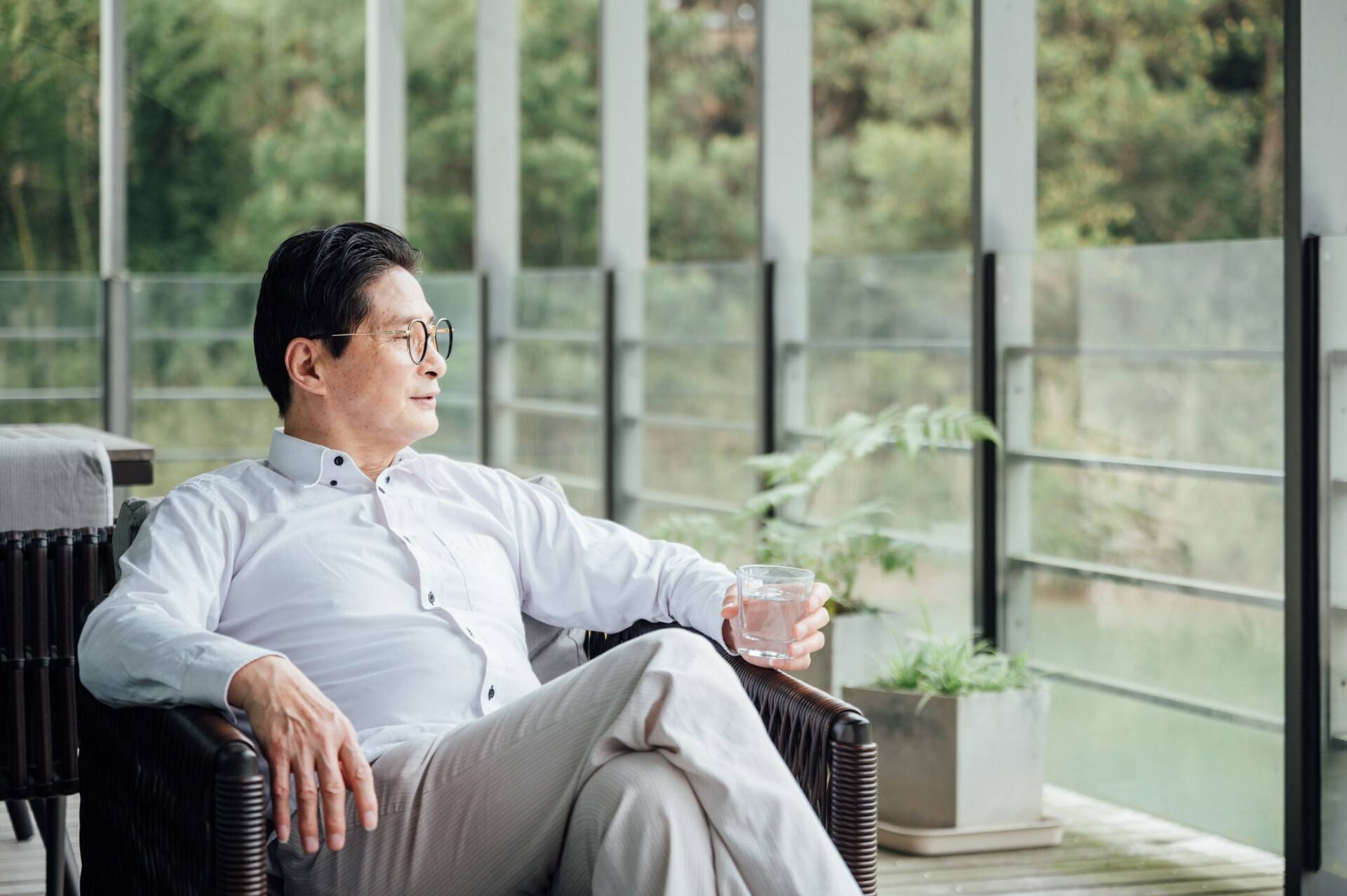 Senior woman sitting by the window